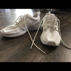 white Nike Roshe sneakers